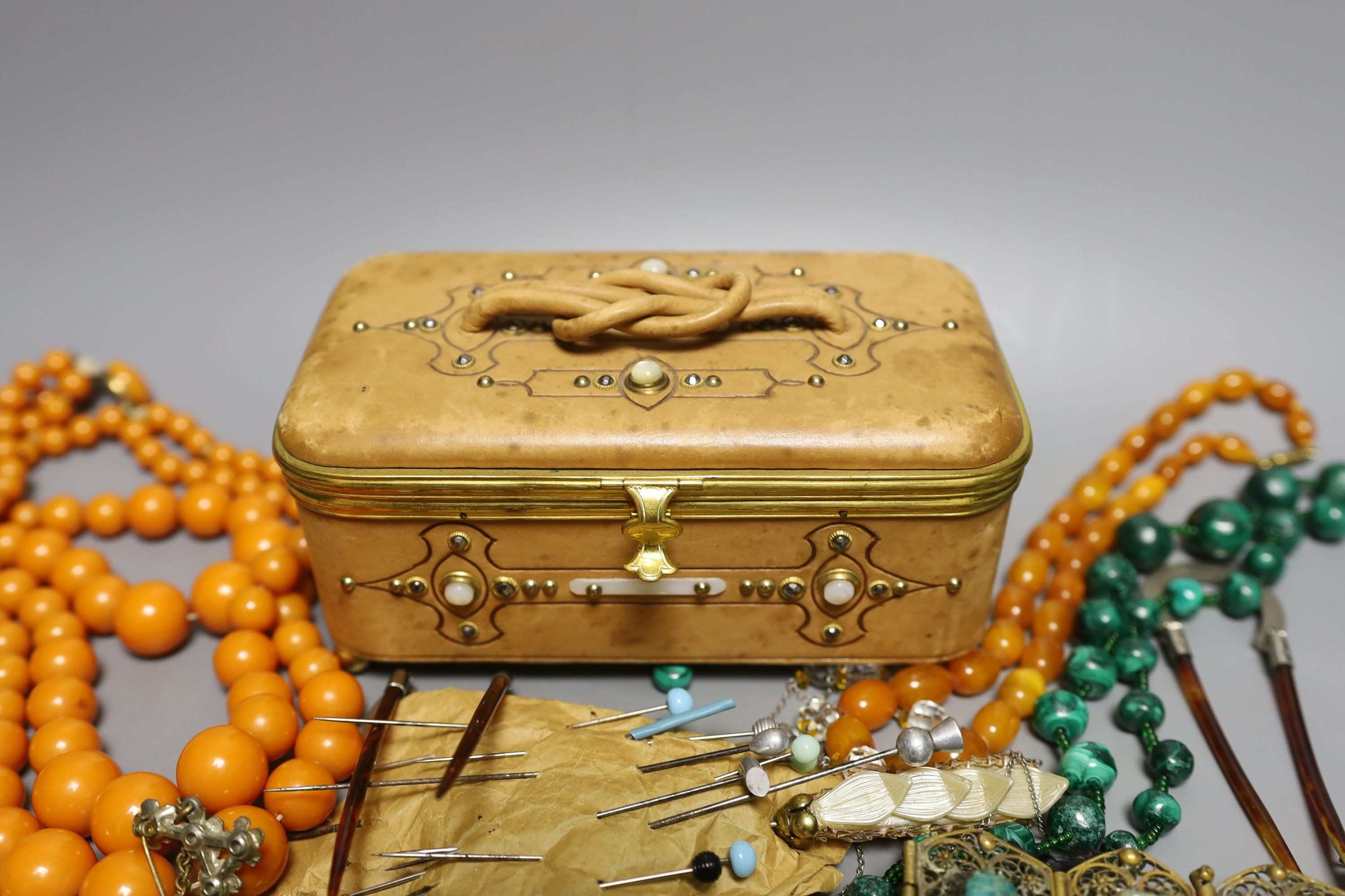 A 19th century calf skin and cut steel mounted trinket box and assorted costume jewellery, including a malachite necklace.